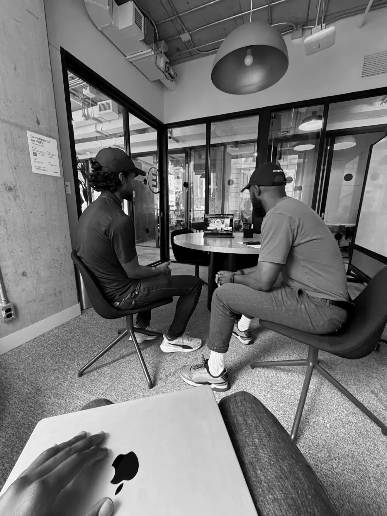 Two Oloodi team members in conversation at the studio